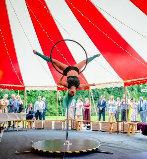 hula hoop circus performer in front of wedding guests