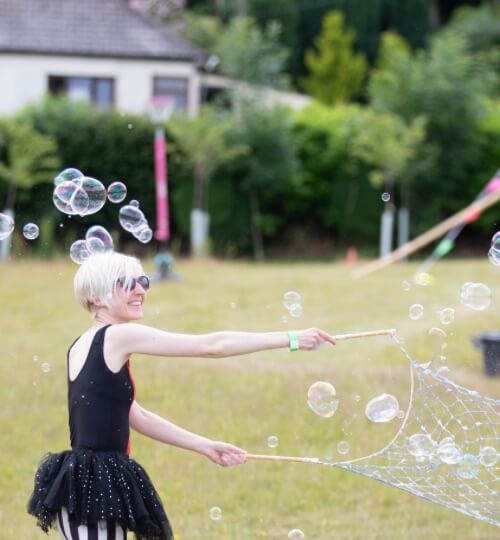 woman playing with bubbles