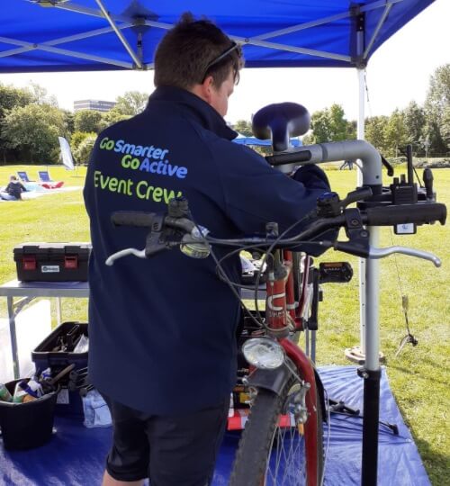 man fixing a bike