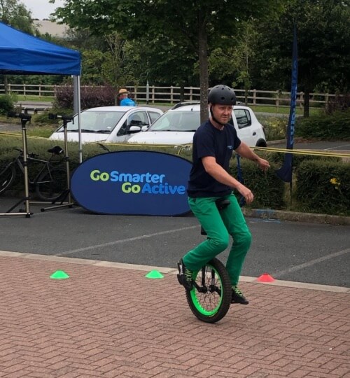 man riding a unicycle