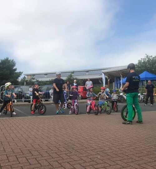 children learning to ride a bike