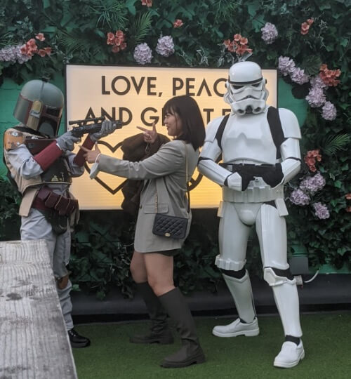 stormtroopers taking pictures with guests